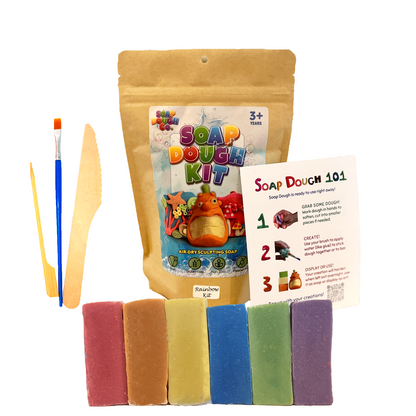 Soap Dough Co. - Rainbow Kit - Wall of yellow, purple, green, orange, blue, and red with eco-bag, instructions, and tools next to soap dough.